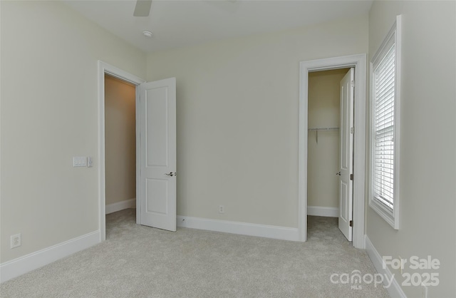 17210 Sulky Plough Rd Unit 1206, Charlotte, NC 28277 - unfurnished bedroom featuring carpet, multiple windows, and a walk in closet