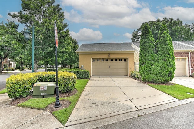 17210 Sulky Plough Rd Unit 1206, Charlotte, NC 28277 - view of front of house featuring concrete driveway, stucco siding, and a garage