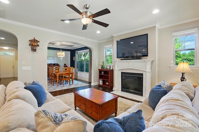 3808 Halcyon Dr, Huntersville, NC 28078 - living room with arched walkways, ceiling fan, ornamental molding, recessed lighting, and wood finished floors