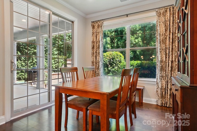 3808 Halcyon Dr, Huntersville, NC 28078 - dining space featuring dark wood-style flooring, plenty of natural light, baseboards, and ornamental molding