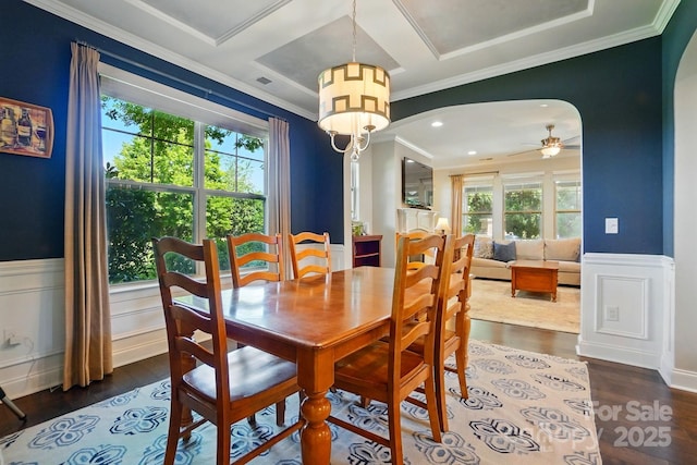 3808 Halcyon Dr, Huntersville, NC 28078 - dining space featuring healthy amount of natural light, arched walkways, wainscoting, dark wood-style flooring, and ornamental molding