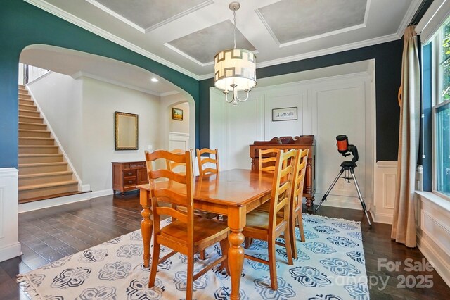 3808 Halcyon Dr, Huntersville, NC 28078 - dining room featuring arched walkways, dark wood-style flooring, ornamental molding, coffered ceiling, and stairway