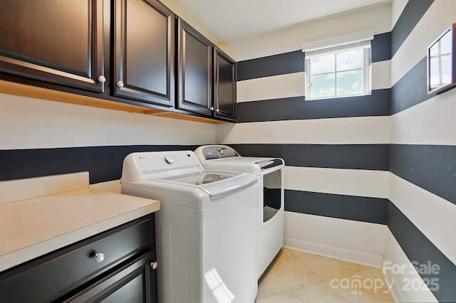 3808 Halcyon Dr, Huntersville, NC 28078 - laundry area with washing machine and clothes dryer, cabinet space, and light tile patterned flooring