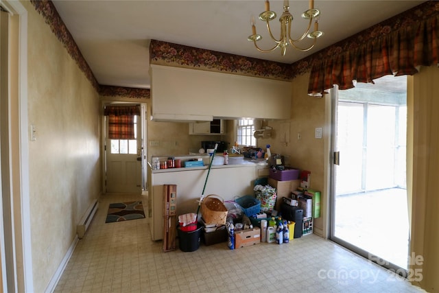 170 Heritage Ln, Salisbury, NC 28147 - kitchen featuring a baseboard radiator, tile patterned floors, a chandelier, and healthy amount of natural light