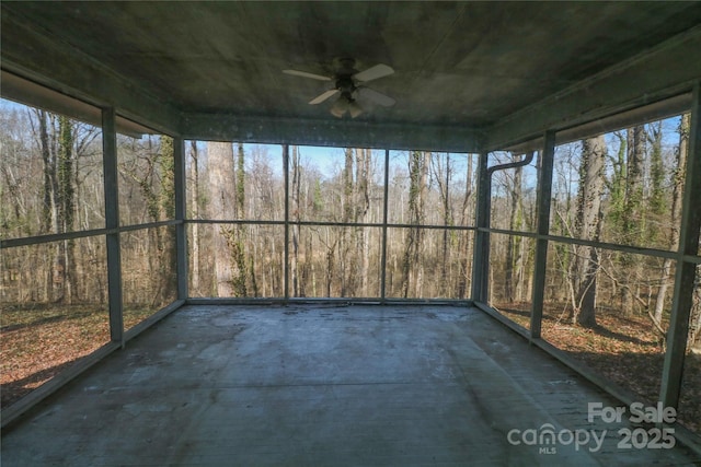 170 Heritage Ln, Salisbury, NC 28147 - unfurnished sunroom with ceiling fan and a view of trees