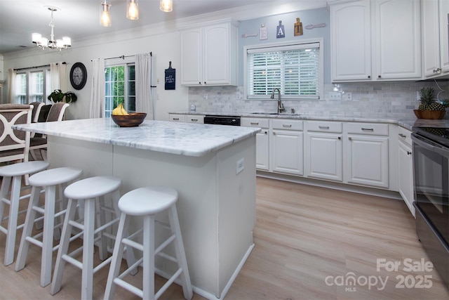 6914 Evanton Loch Rd, Charlotte, NC 28278 - kitchen with a sink, black appliances, a breakfast bar, light stone countertops, and tasteful backsplash