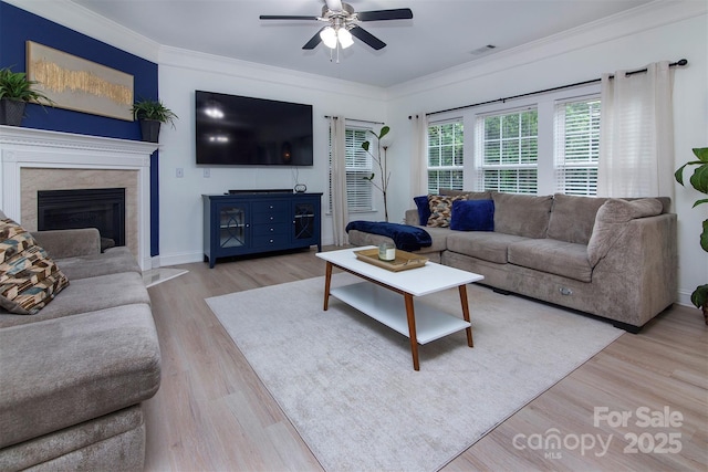 6914 Evanton Loch Rd, Charlotte, NC 28278 - living room featuring a ceiling fan, wood finished floors, ornamental molding, a fireplace, and baseboards
