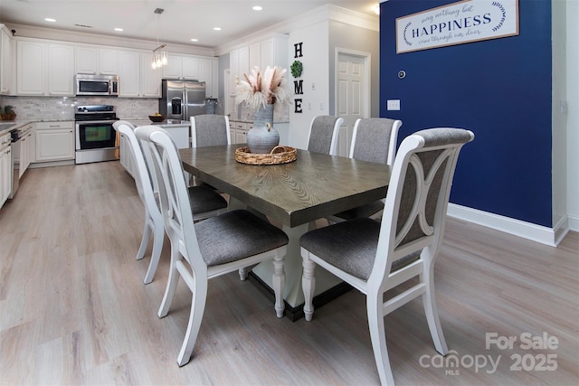 6914 Evanton Loch Rd, Charlotte, NC 28278 - dining room with ornamental molding, light wood finished floors, baseboards, and recessed lighting