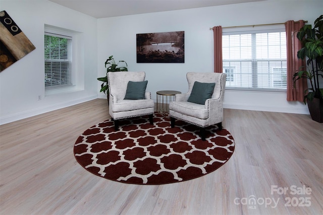 6914 Evanton Loch Rd, Charlotte, NC 28278 - living area featuring wood finished floors and baseboards