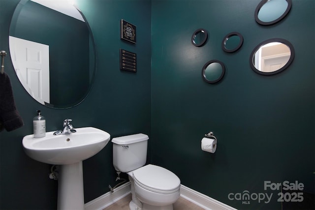 6914 Evanton Loch Rd, Charlotte, NC 28278 - bathroom with toilet, baseboards, and wood finished floors
