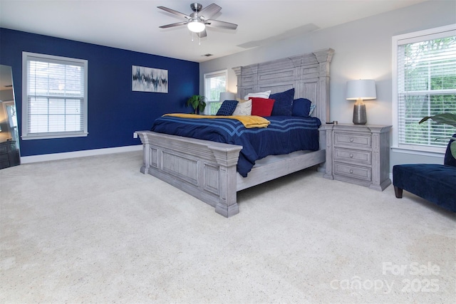 6914 Evanton Loch Rd, Charlotte, NC 28278 - carpeted bedroom with multiple windows, baseboards, and a ceiling fan