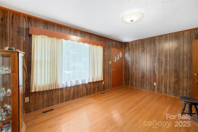 208 Lipe Rd, Troutman, NC 28166 - spare room with wood finished floors and wood walls