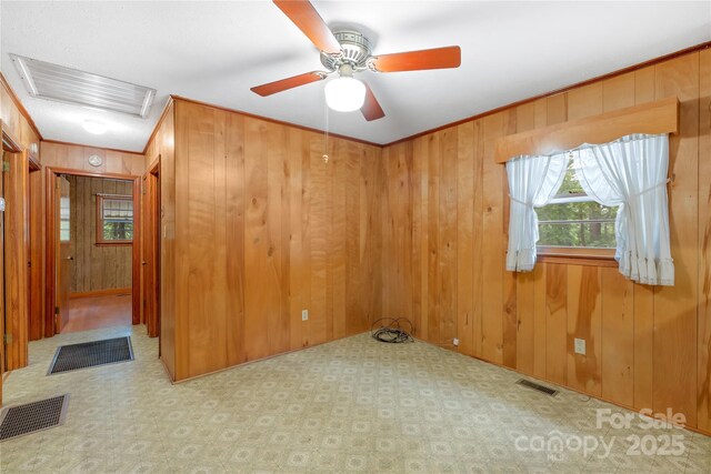 208 Lipe Rd, Troutman, NC 28166 - unfurnished room featuring attic access, wood walls, crown molding, and a ceiling fan