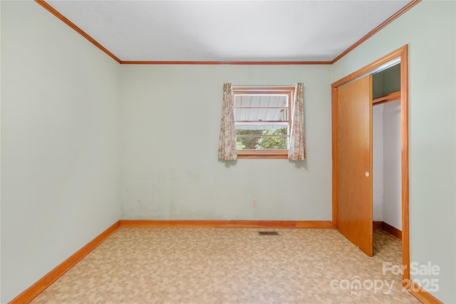 208 Lipe Rd, Troutman, NC 28166 - unfurnished bedroom featuring crown molding, baseboards, and a closet