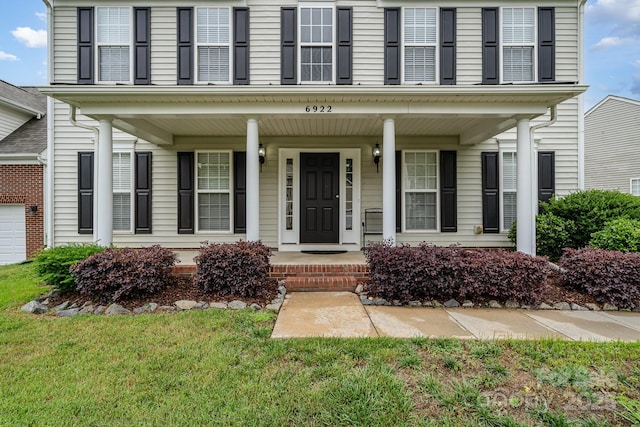 6922 Cascade Dream Ct, Huntersville, NC 28078 - view of front of house featuring covered porch and a front yard