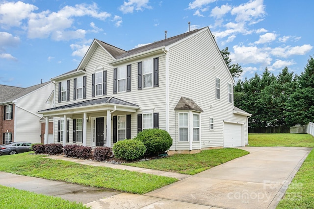 6922 Cascade Dream Ct, Huntersville, NC 28078 - view of front of home featuring driveway, a front lawn, an attached garage, and a porch