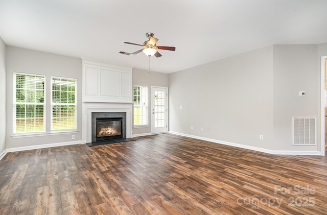 6922 Cascade Dream Ct, Huntersville, NC 28078 - unfurnished living room with dark wood finished floors, baseboards, ceiling fan, and a large fireplace