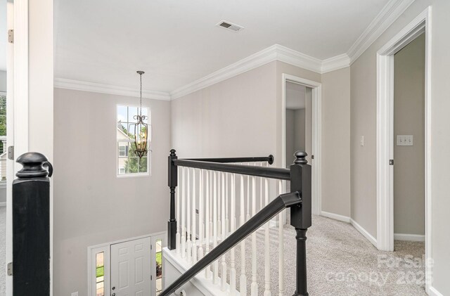 6922 Cascade Dream Ct, Huntersville, NC 28078 - hallway with an upstairs landing, a chandelier, carpet, baseboards, and ornamental molding