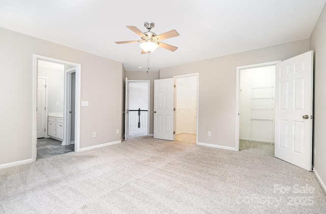 6922 Cascade Dream Ct, Huntersville, NC 28078 - unfurnished bedroom featuring a walk in closet, carpet flooring, baseboards, and a closet