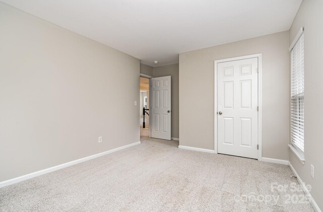 6922 Cascade Dream Ct, Huntersville, NC 28078 - unfurnished bedroom with carpet and baseboards