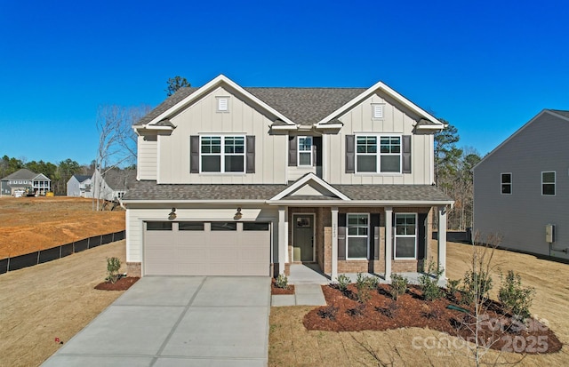 1048 Waxhaw Crossing Dr Unit 261, Waxhaw, NC 28173 - view of front facade with driveway, an attached garage, board and batten siding, roof with shingles, and brick siding