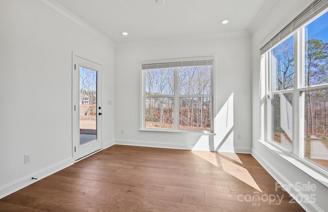 1048 Waxhaw Crossing Dr Unit 261, Waxhaw, NC 28173 - empty room featuring dark wood finished floors, ornamental molding, baseboards, and recessed lighting