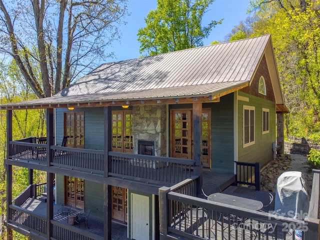 315 Black Bear Xing, Bryson City, NC 28713 - rear view of house featuring a deck, stone siding, and metal roof