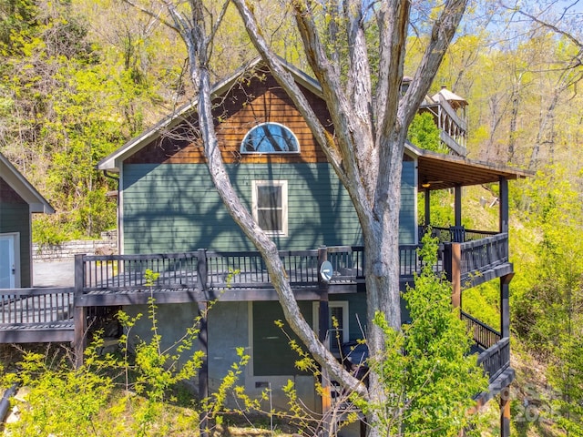 315 Black Bear Xing, Bryson City, NC 28713 - view of property exterior featuring a wooden deck and a view of trees