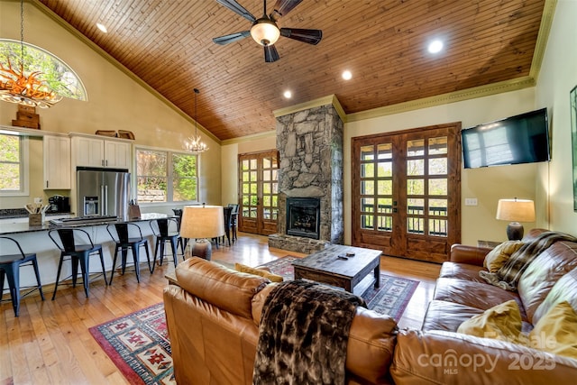 315 Black Bear Xing, Bryson City, NC 28713 - living room featuring a chandelier, wooden ceiling, a ceiling fan, crown molding, and healthy amount of natural light