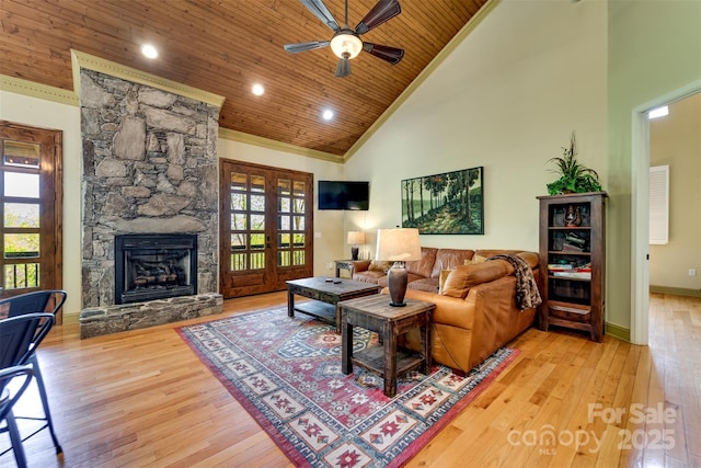 315 Black Bear Xing, Bryson City, NC 28713 - living area with wood ceiling, hardwood / wood-style floors, a ceiling fan, a stone fireplace, and high vaulted ceiling