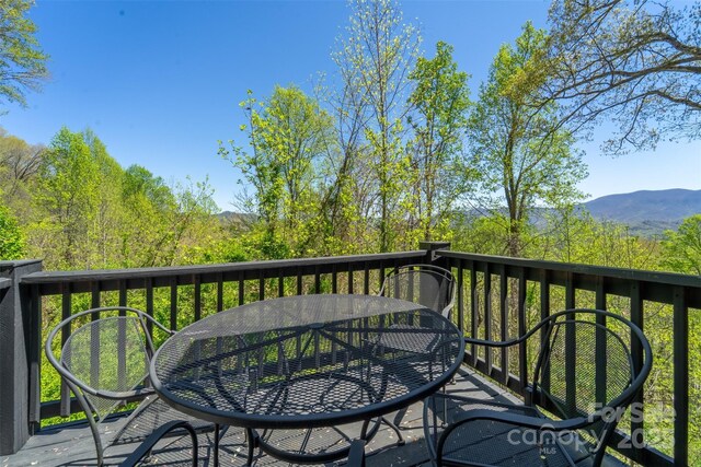 315 Black Bear Xing, Bryson City, NC 28713 - wooden terrace featuring outdoor dining area and a mountain view