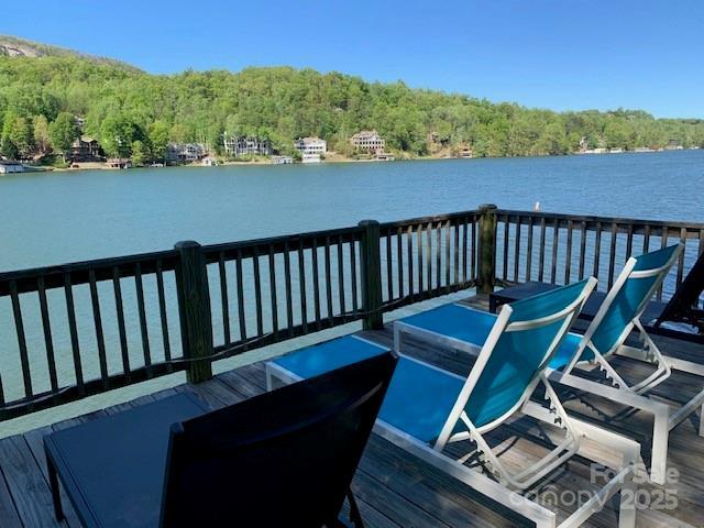 194 Mark Twain Dr, Lake Lure, NC 28743 - dock featuring a wooded view and a water view