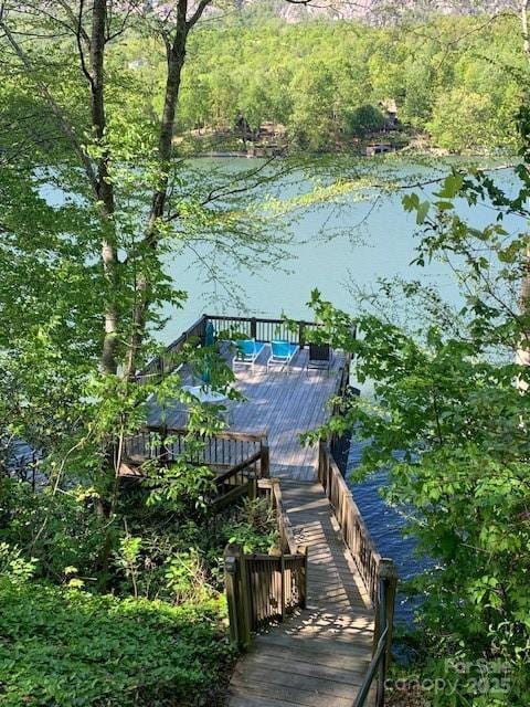 194 Mark Twain Dr, Lake Lure, NC 28743 - dock area featuring a deck with water view and a wooded view