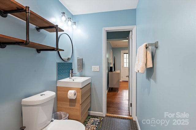 194 Mark Twain Dr, Lake Lure, NC 28743 - bathroom featuring vanity, toilet, tile patterned floors, and baseboards