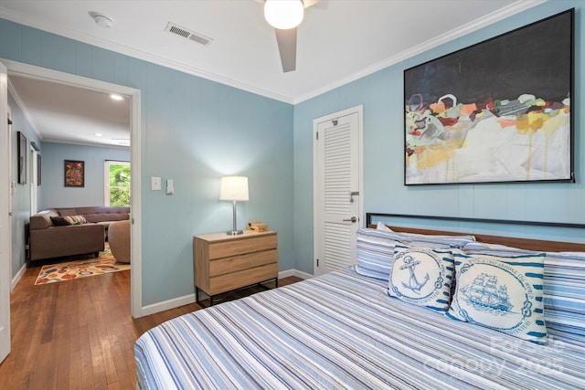 194 Mark Twain Dr, Lake Lure, NC 28743 - bedroom with ornamental molding, hardwood / wood-style flooring, baseboards, a closet, and a ceiling fan