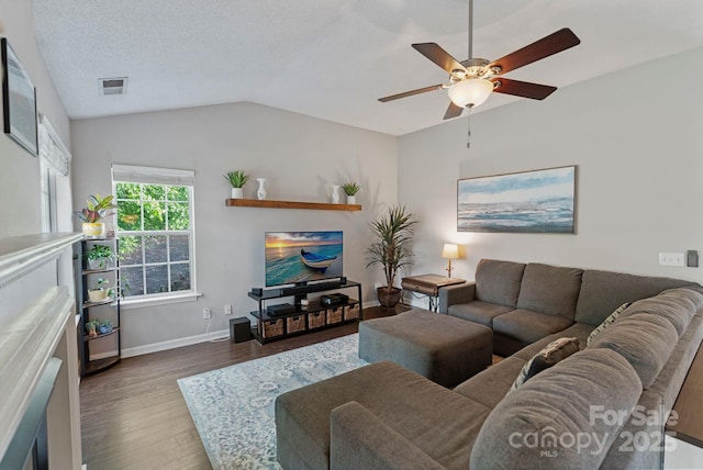 1310 Bellhook Pl NW, Concord, NC 28027 - living area with wood finished floors, a ceiling fan, vaulted ceiling, and baseboards