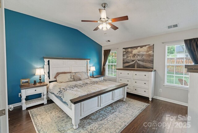 1310 Bellhook Pl NW, Concord, NC 28027 - bedroom with dark wood-type flooring, vaulted ceiling, baseboards, and ceiling fan