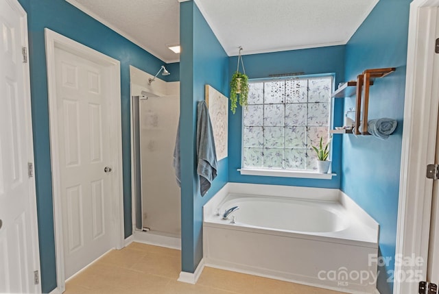 1310 Bellhook Pl NW, Concord, NC 28027 - bathroom featuring a garden tub, a shower stall, tile patterned flooring, and a textured ceiling