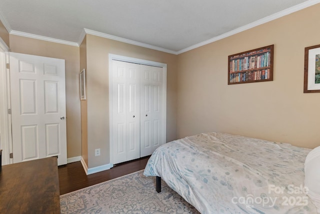 1310 Bellhook Pl NW, Concord, NC 28027 - bedroom with dark wood-style floors, baseboards, crown molding, and a closet