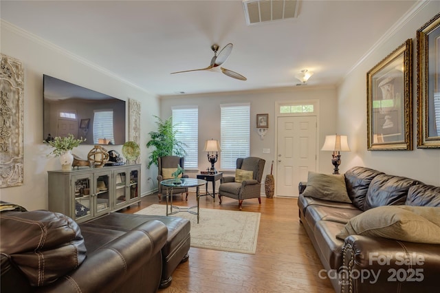 1225 Assembly St, Belmont, NC 28012 - living area with ornamental molding, wood finished floors, and ceiling fan