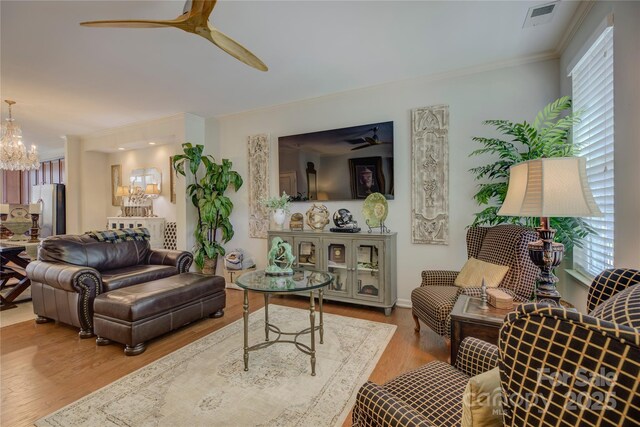 1225 Assembly St, Belmont, NC 28012 - living room with ornamental molding, a ceiling fan, and healthy amount of natural light
