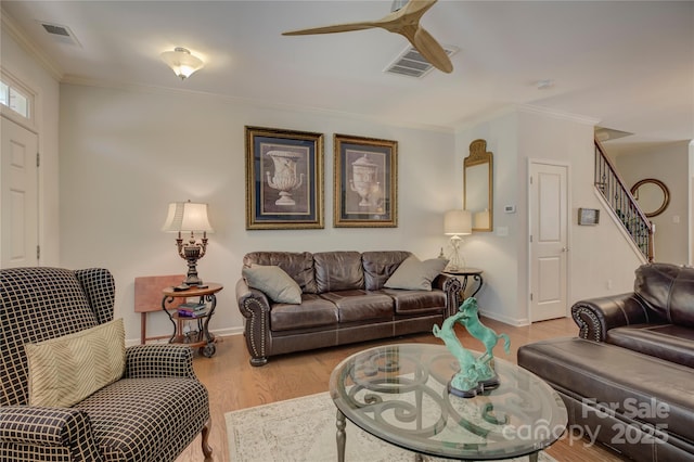1225 Assembly St, Belmont, NC 28012 - living area with a ceiling fan, light wood-type flooring, stairway, baseboards, and crown molding