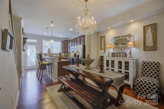 1225 Assembly St, Belmont, NC 28012 - dining room with ornamental molding, a chandelier, recessed lighting, dark wood finished floors, and baseboards