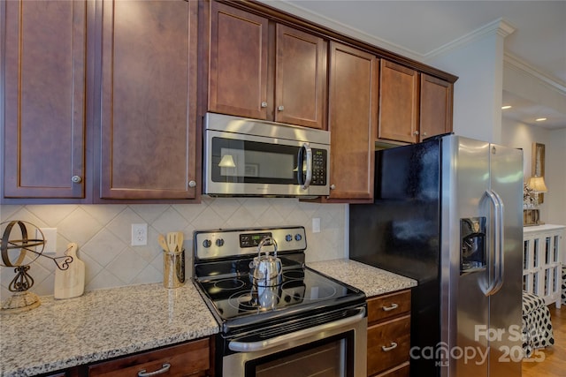 1225 Assembly St, Belmont, NC 28012 - kitchen with appliances with stainless steel finishes, light stone countertops, backsplash, and ornamental molding