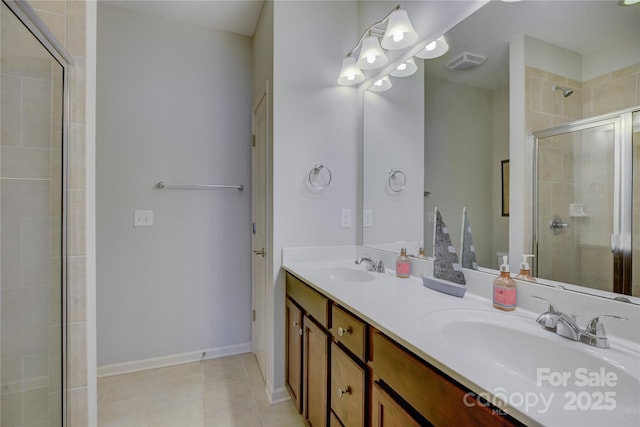 1225 Assembly St, Belmont, NC 28012 - bathroom with a stall shower, double vanity, tile patterned flooring, and baseboards