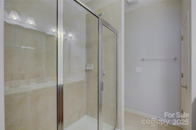 1225 Assembly St, Belmont, NC 28012 - bathroom with a stall shower, baseboards, and tile patterned floors
