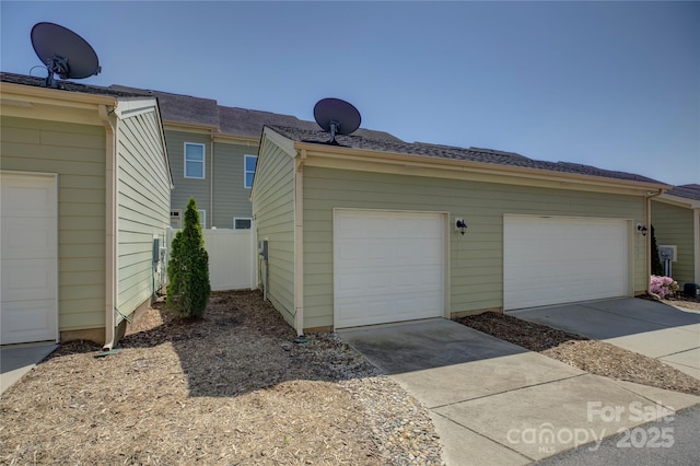 1225 Assembly St, Belmont, NC 28012 - view of home's exterior with a garage and driveway