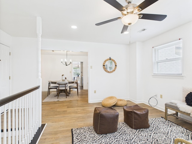 4905 Chestnut Lake Dr, Charlotte, NC 28227 - sitting room with light wood finished floors, ceiling fan, a chandelier, baseboards, and recessed lighting