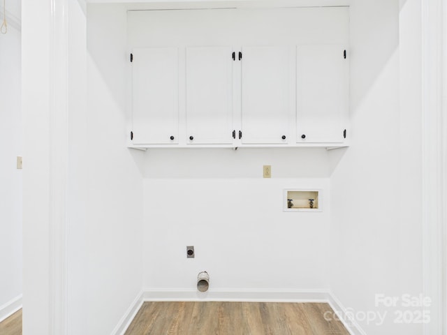 4905 Chestnut Lake Dr, Charlotte, NC 28227 - laundry room with cabinet space, hookup for a washing machine, electric dryer hookup, light wood-style flooring, and baseboards