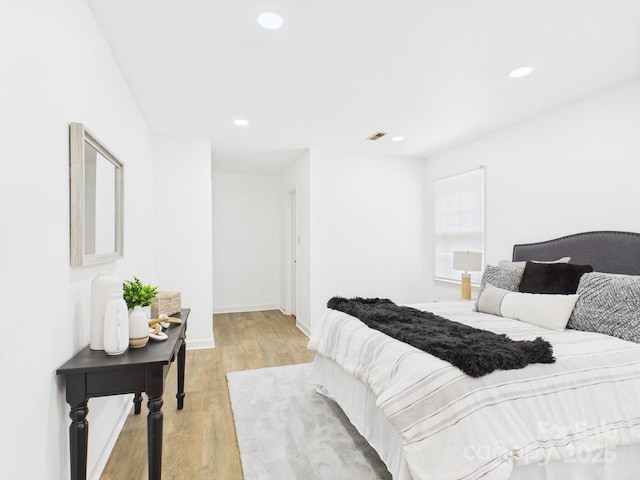 4905 Chestnut Lake Dr, Charlotte, NC 28227 - bedroom featuring light wood-style flooring, recessed lighting, and baseboards